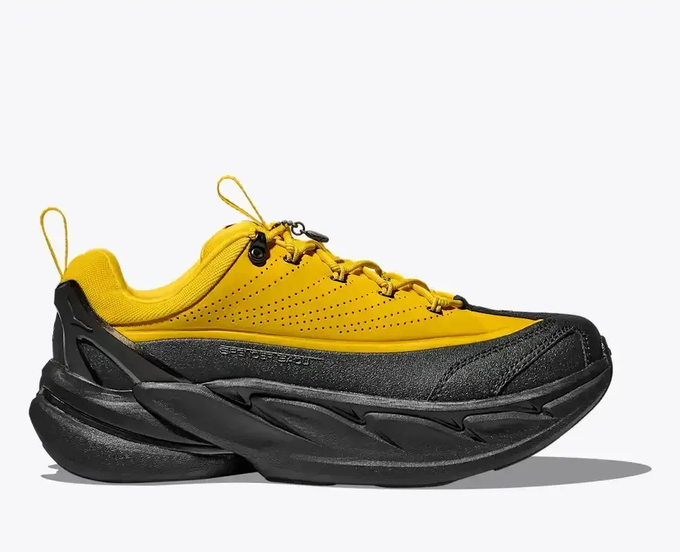 HOKA Elevon X Spencer Badu Zest Schwarz Media front view